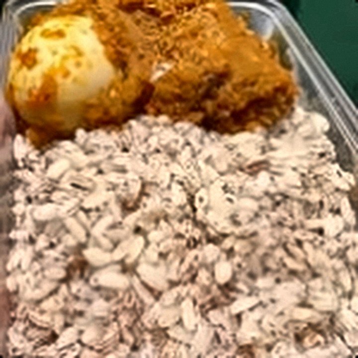 Ofada rice with sauce and egg